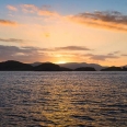 Západ slunce nad Stewart Island, Nový Zéland | fotografie